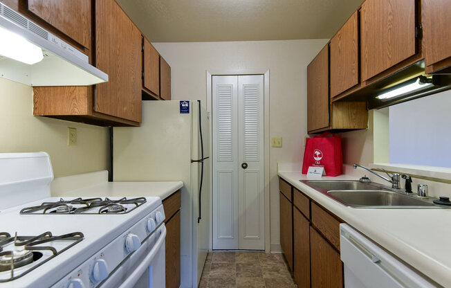 Galley Kitchen with Dishwasher and Pantry at Old Monterey Apartments, Missouri, 65807
