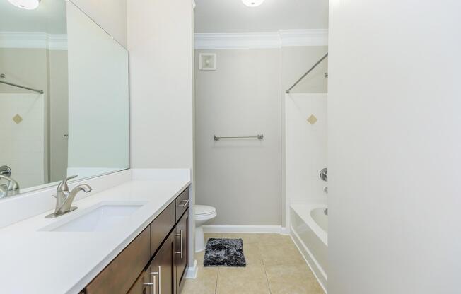 a kitchen with a sink and a mirror