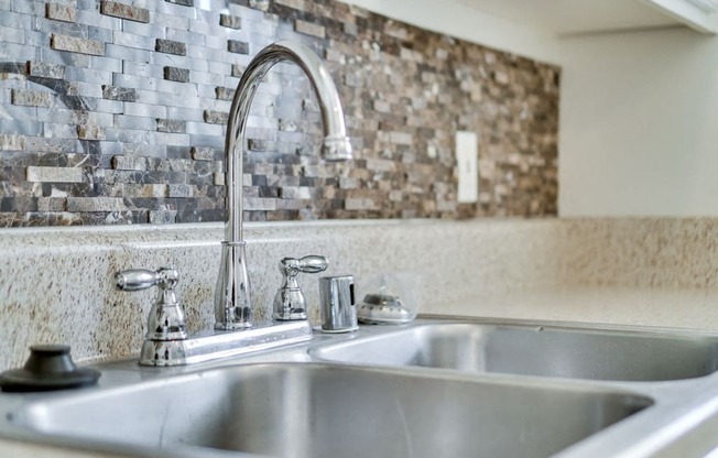 Stainless Steel Sink With Faucet at Highlander Park Apts, Riverside