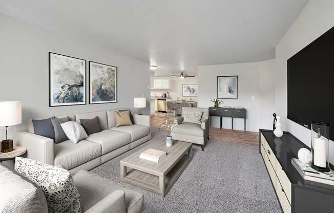 A living room with a grey carpet and a grey couch.