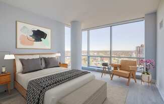 3thirty3 new rochelle ny apartment high rise photo of bedroom with large windows and modern furnishings