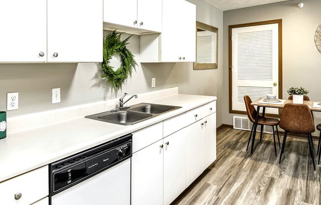 Two bedroom apartment homes with large kitchens and plank flooring at Flatwater in La Vista , NE