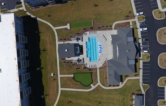 an overhead view of a swimming pool on the side of a building