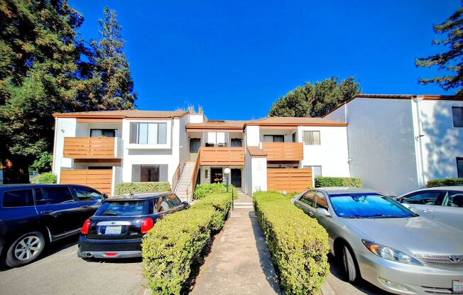 Spacious First Floor 2bd Condo With Laundry In Unit, Pool, Patio, & Carport!