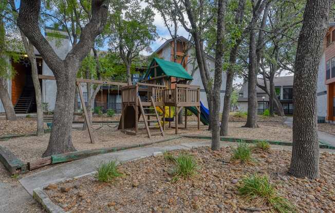 a playground at the whispering winds apartments in pearland, tx