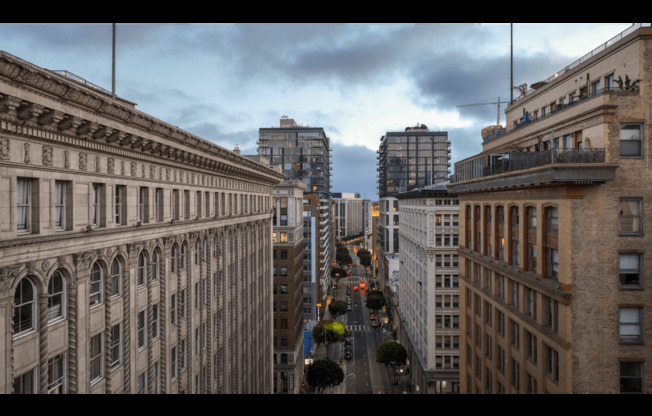 a view of a city street from the roof of a building