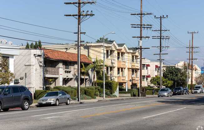 A street scene with cars and buildings.