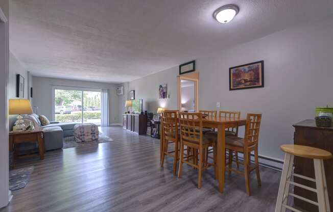 a view of the dining room and living room from the kitchen