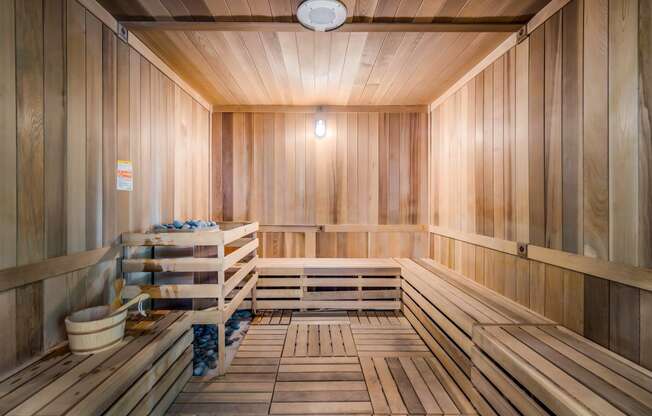 an empty finnish sauna with wooden walls and floors