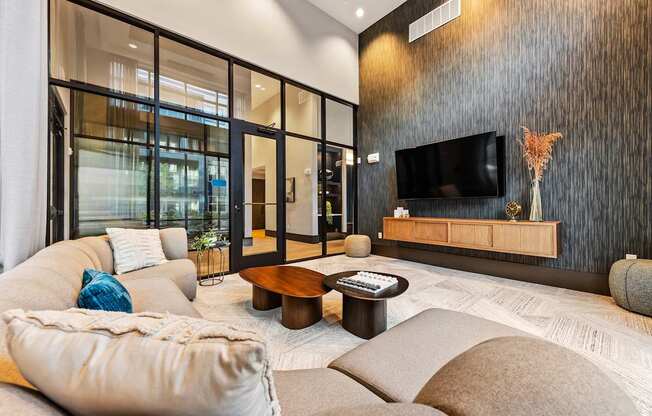 Private lounge with a flat screen TV mounted on the wall at Preston Ridge in Cary, NC.