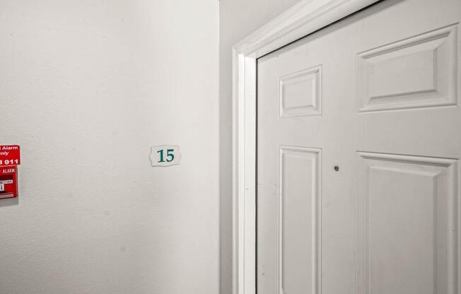 a white door with a number 15 on it