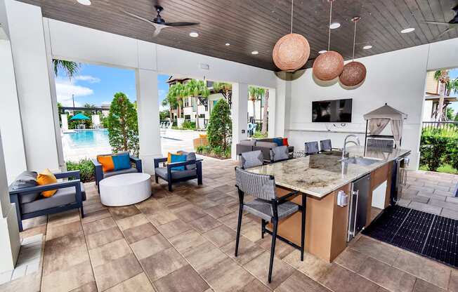 take a seat at the kitchen island and enjoy the views of the pool and beach