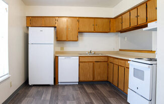 apartment kitchen with white appliances