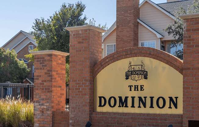 The Dominion Apartments sign in Lubbock TX