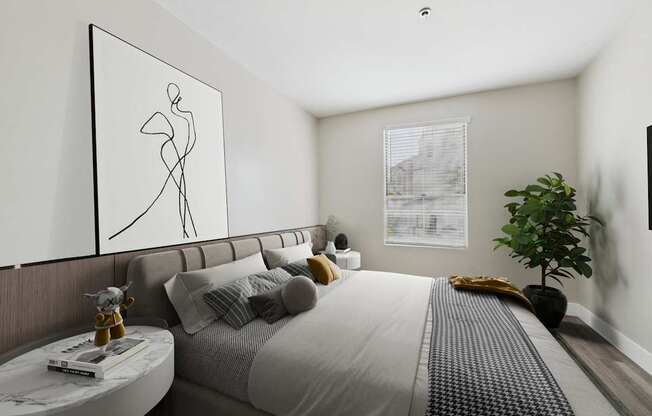 A modern bedroom with a large bed and a framed abstract art piece on the wall.