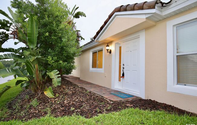 Beautiful 3/2 Corner Duplex with Water View in Highly Sought After Gated Community of Village Walk - Lake Nona!