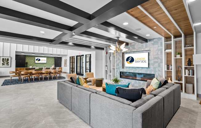 a living room with couches and chairs and a fireplace