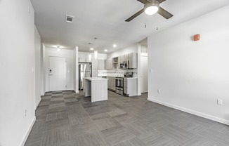 One and two Bedroom Apartment Homes with Large Kitchens with ample storage and light cabinets, quarts countertops and stainless steel appliances at Pinnacle Heights Apartments in Rogers, Arkansas