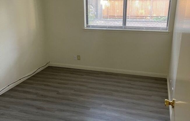 A Large two-bedroom in a modern building, with newly installed Hardwood Flooring