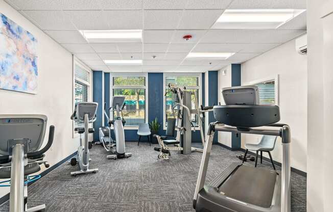 a gym with cardio equipment and exercise machines