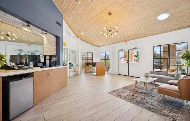 A modern kitchen with wooden floors and a wooden ceiling.