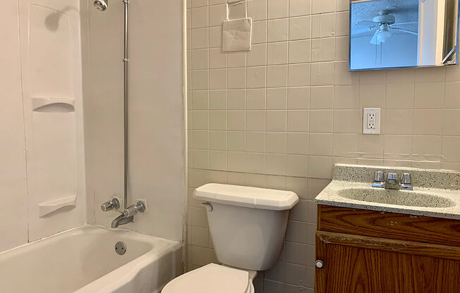 a bathroom with a toilet sink and bathtub