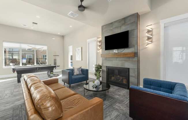 the retreat apartments l living room with fireplace and tv