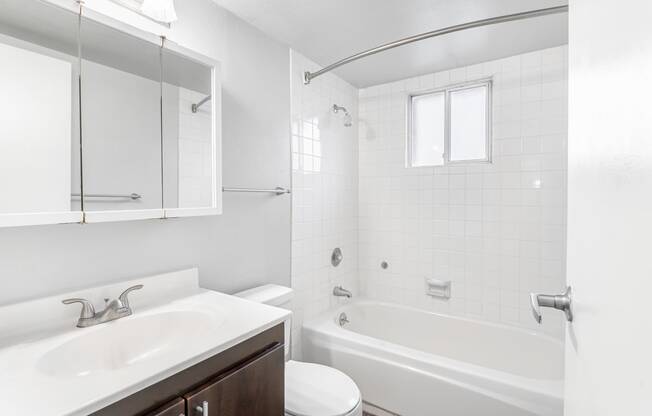 a bathroom with a sink toilet and bathtub