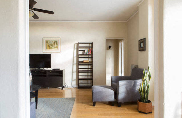 a living room with a couch and a tv in it