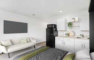 A modern living room with a white couch and a grey bed.