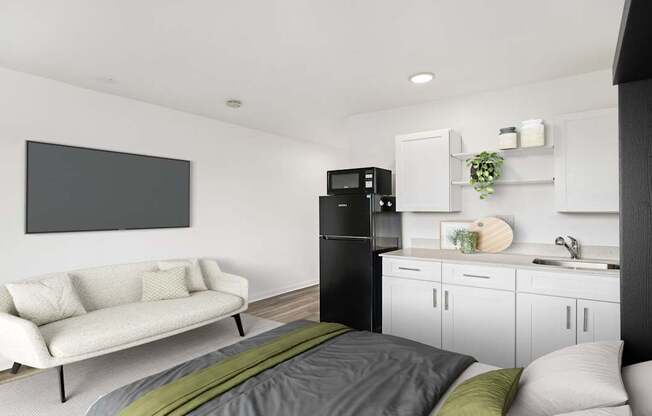 A modern living room with a white couch and a grey bed.