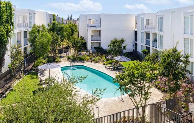 a swimming pool in the middle of an apartment building