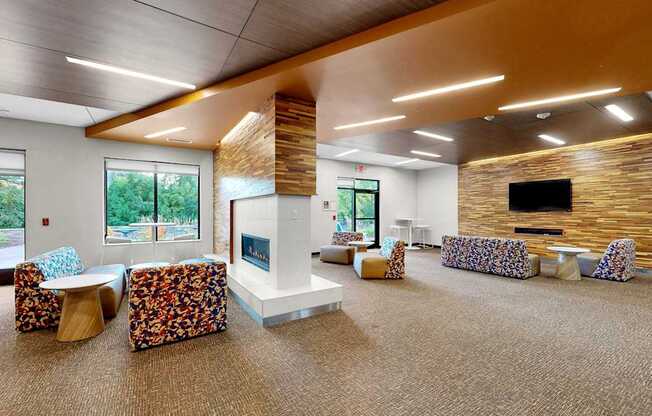 A modern room with a stone wall and a fireplace.
