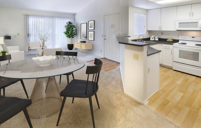 Kitchen and Carpeted Living Room with Balcony