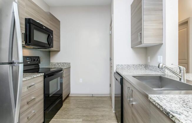 a stove top oven sitting inside of a kitchen