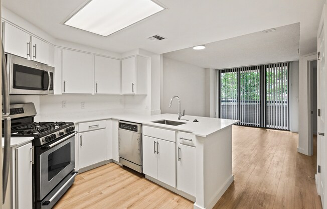 renovated kitchen with quartz counters and stainless steel appliances