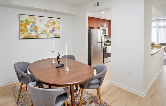 Located just off the kitchen, the Ellington’s dining nook is a cozy, dedicated space for meals or a home workstation. The area features new vinyl plank wood-style flooring and updated lighting, perfectly complementing the nearby granite countertops and custom cabinetry.