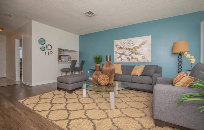 a living room filled with furniture and a rug