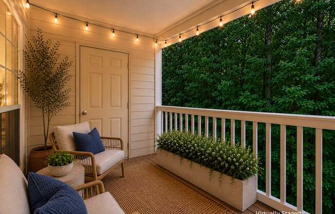 A balcony with a white railing and a white door.