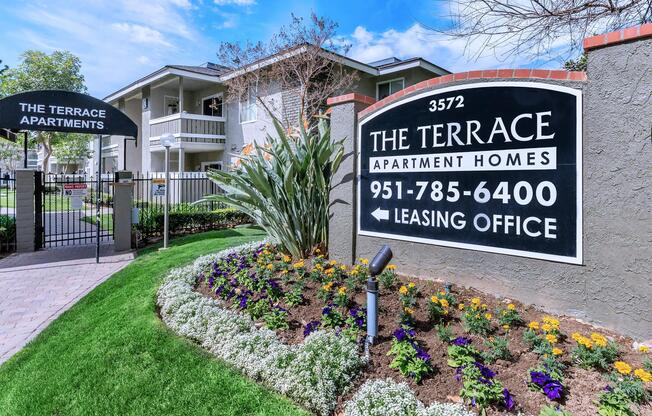 a house that has a sign on the side of a building