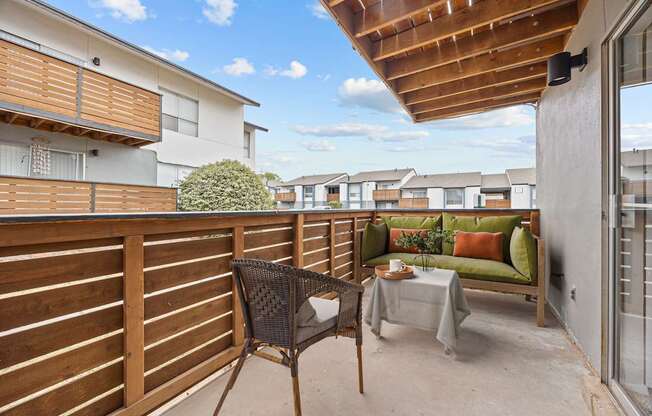 A patio with a table and chairs is shown.