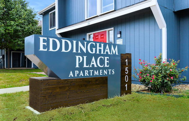 a blue building with a sign that says eddingham place apartments