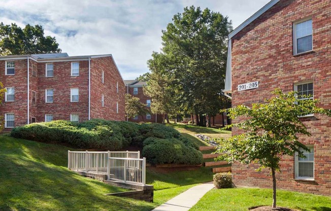 A red brick building with the number 201-205 on it.