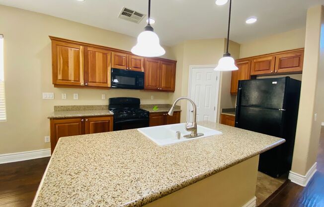 Beautiful & large Rhodes Ranch guard gated community 4 bedroom home with the master bedroom downstairs and a big loft upstairs! With a covered backyard patio. Community features pool, spa, gym, and parks!
