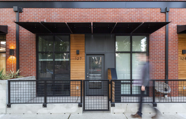 Exterior entrance of a modern apartment with an enclosed covered patio at 6 Wood Flats, Lacey