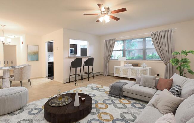 a living room filled with furniture and a large window