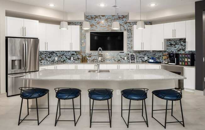 Clubhouse Kitchen Breakfast Bar with Stools at Abberly Solaire Apartment Homes, Garner, North Carolina