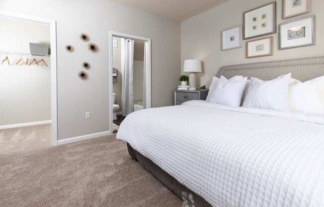 a bedroom with a large bed and a closet at Ansley at Town Center in Evans GA