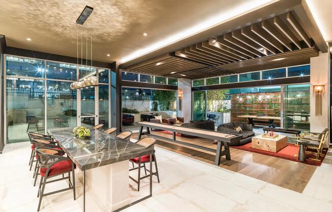 Sophisticated lounge spaces at Modera Argyle feature stylish seating, shuffleboard, and inviting areas to relax, entertain, or connect with neighbors.