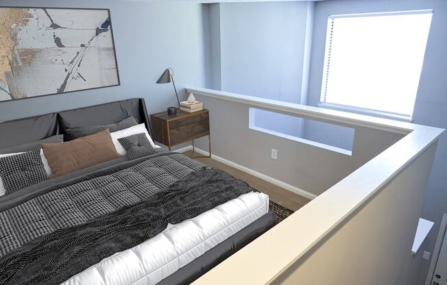 Greentree Apartments in Savannah, GA photo of a bedroom with a bed and a ledge with a window